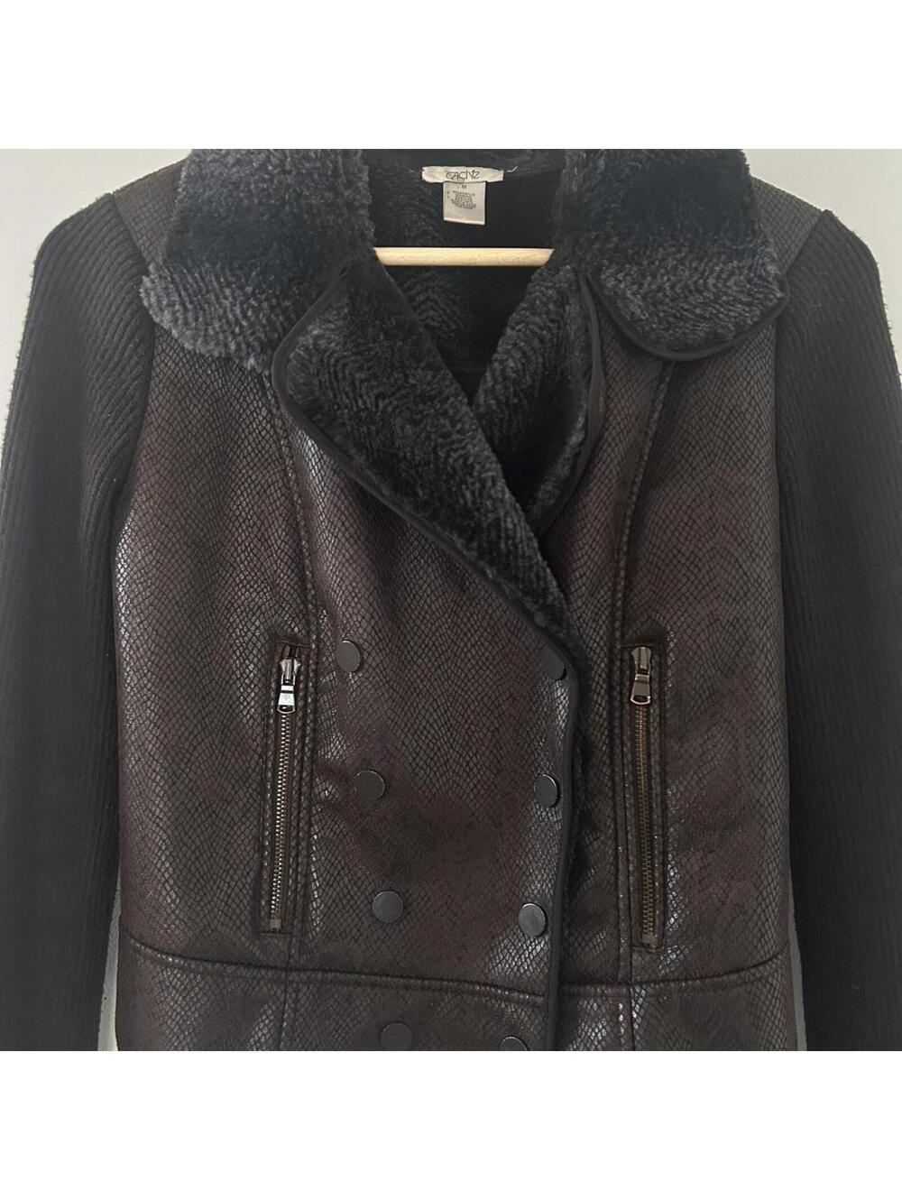 Cache black faux leather jacket with fur collar and button details.